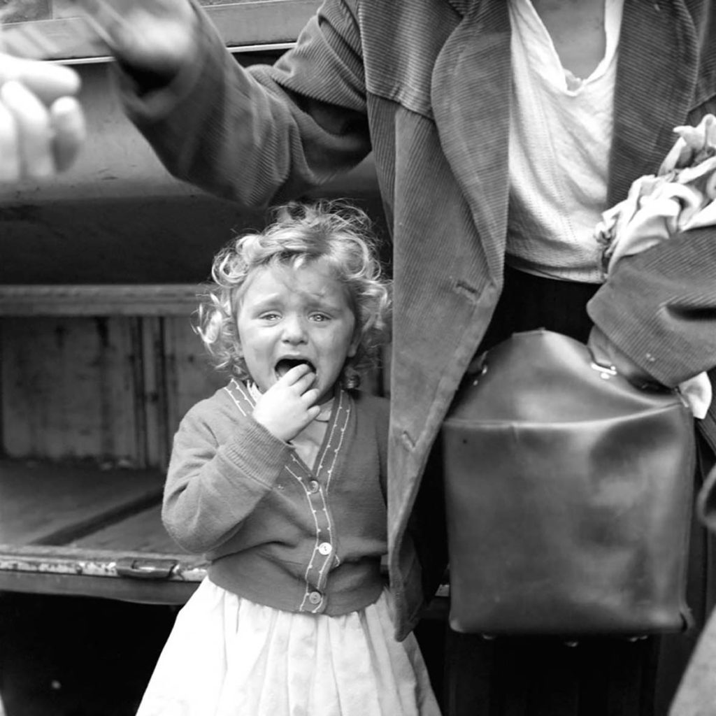 Vivian Maier's photograph of a baby girl crying black and white