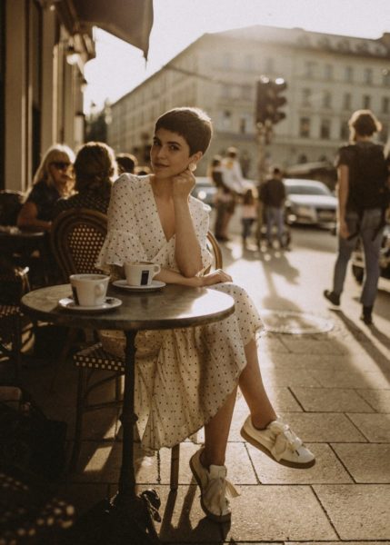 Woman sitting at the table in a cafe