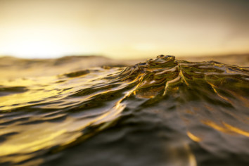 Sea water swelling as dusk